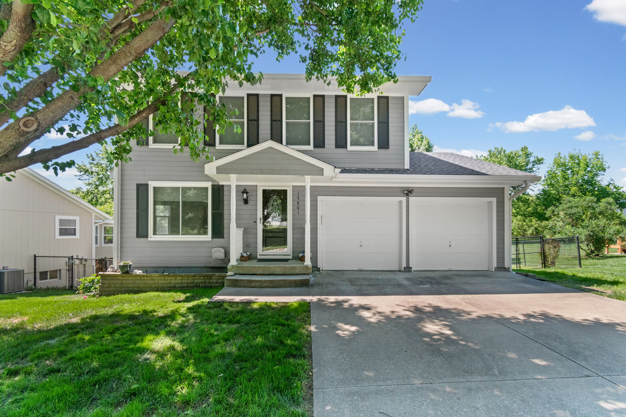 Front exterior of 15801 E 2nd Street S, Independence, MO — two-story home in the Three Trails subdivision