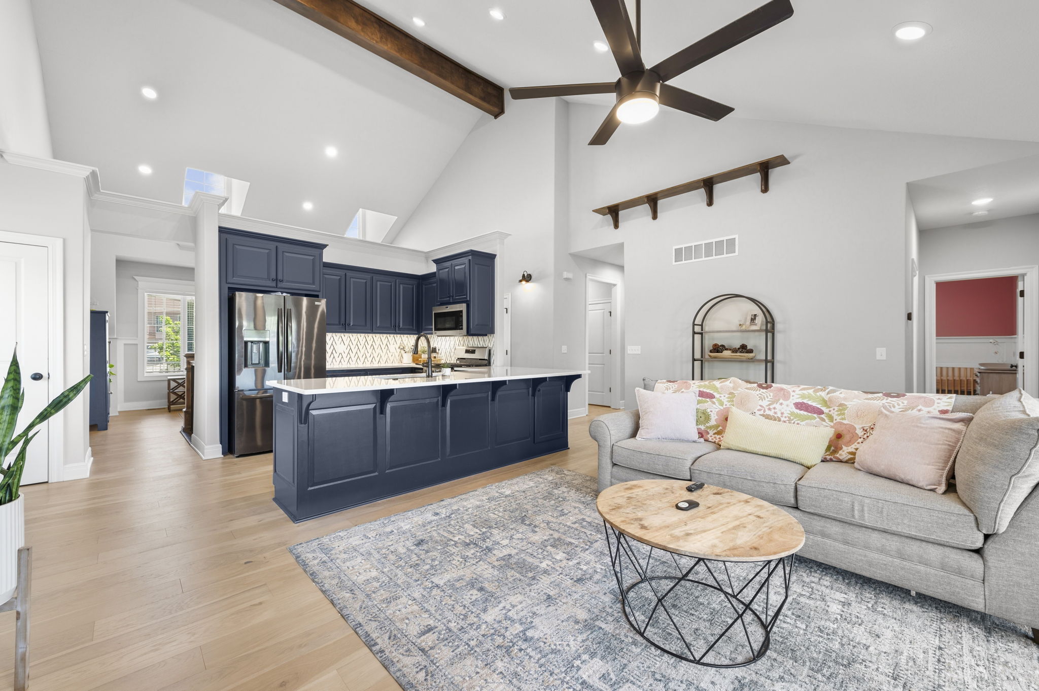 Kitchen with blue cabinetry and gas range