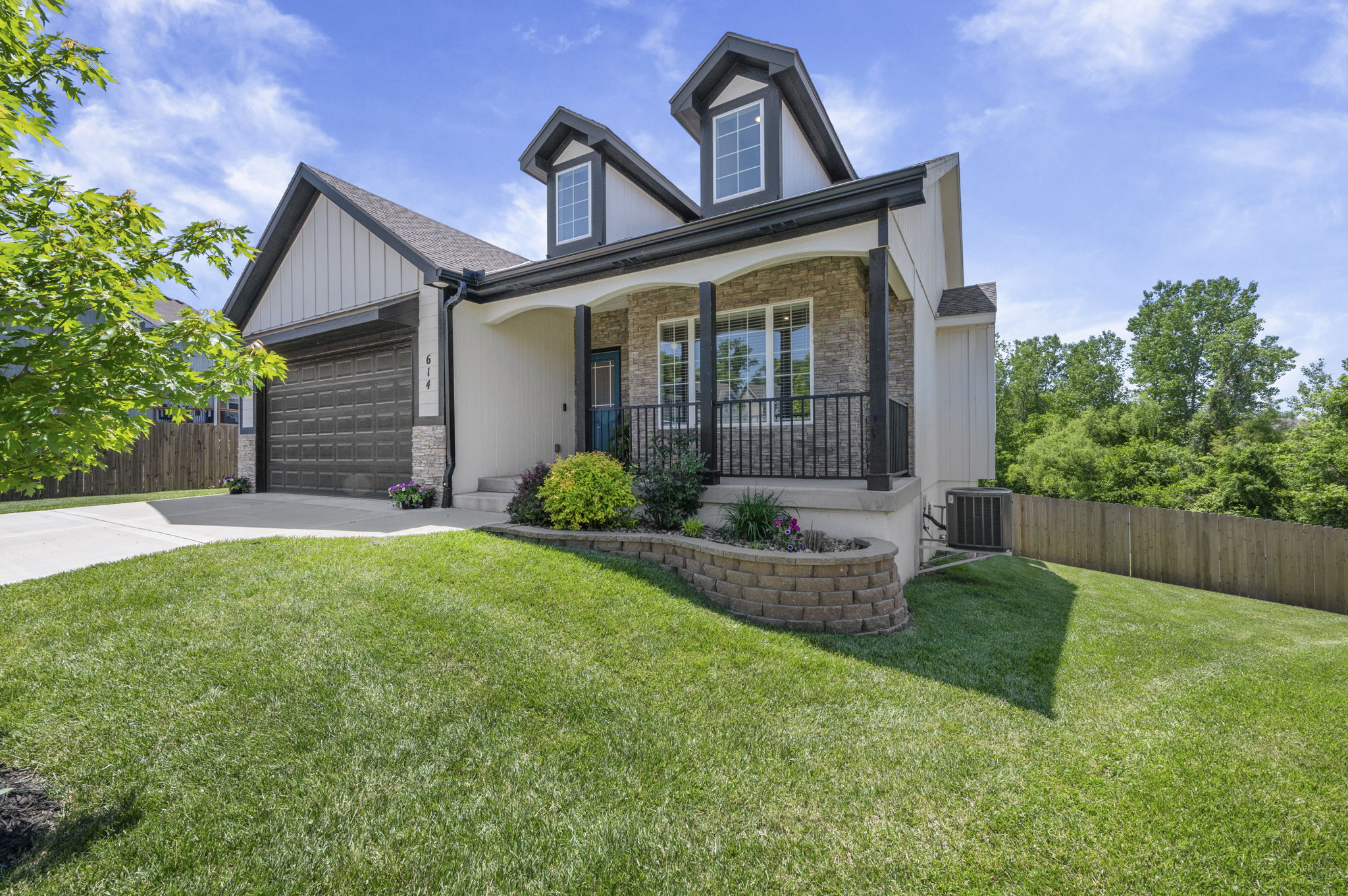 Covered patio and privacy-fenced backyard