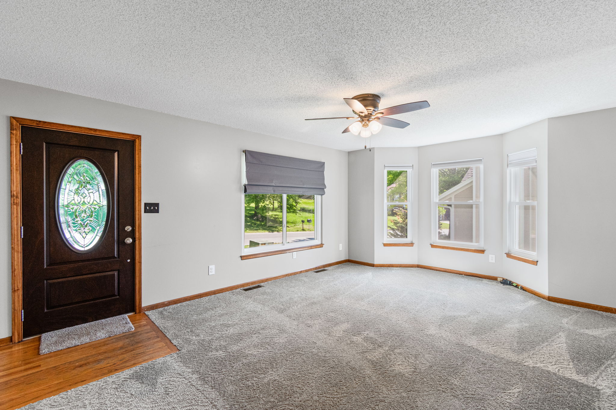 Living room with bay window at 15801 E 2nd Street S, Independence, MO