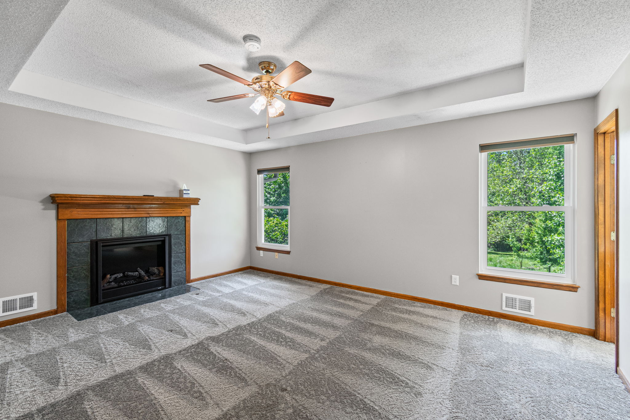 Primary suite with fireplace at 15801 E 2nd Street S, Independence, MO