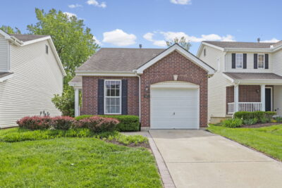 Brick-and-vinyl ranch home at 1921 NW 82nd Street in Timber Hills, Kansas City