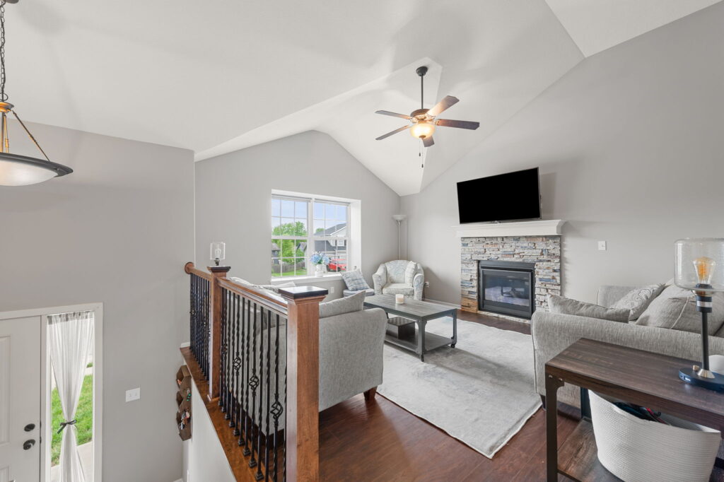 Vaulted great room with stone fireplace at 11907 N Tracy Avenue