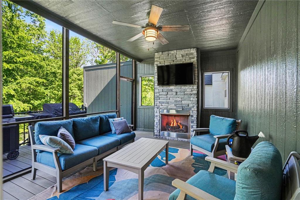 1784 Homestead Drive, Liberty MO — Screened deck with its own stacked-stone fireplace for cool evenings.