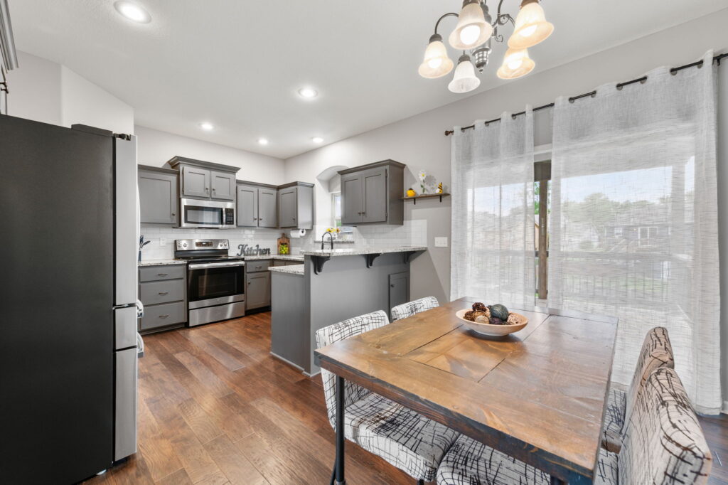 Open kitchen and dining area at 11907 N Tracy Avenue, Kansas City