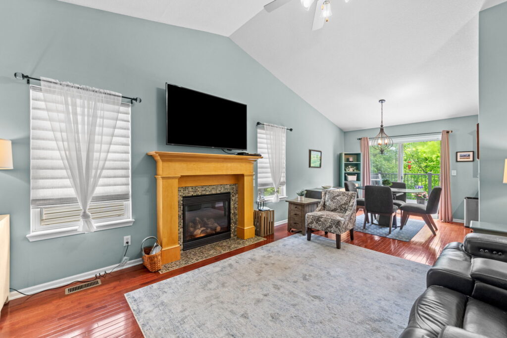 Vaulted living room centered on a gas fireplace