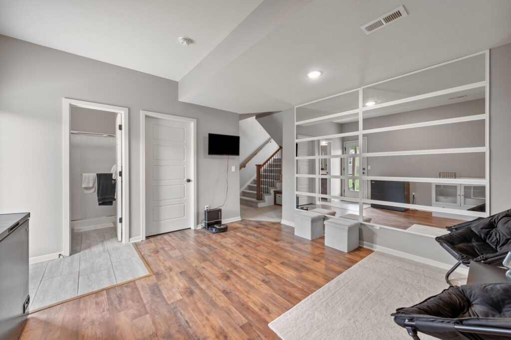 Finished lower-level family room at 11907 N Tracy Avenue