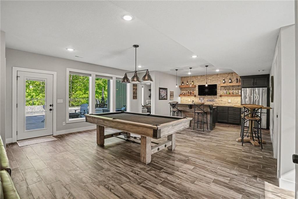 1784 Homestead Drive, Liberty MO — Walk-out basement bar and billiards — built for game day.