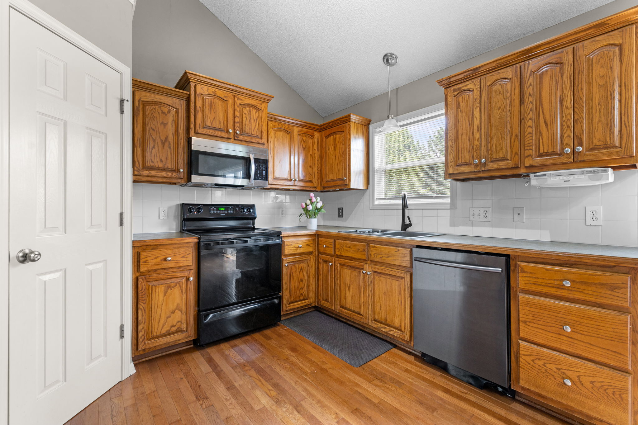 Kitchen with wood floors at 6819 NE 113th Terrace, Kansas City, MO 64156