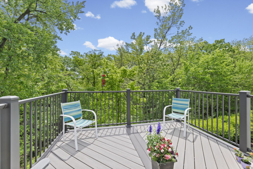 2023 deck overlooking a treed backyard with no neighbors behind