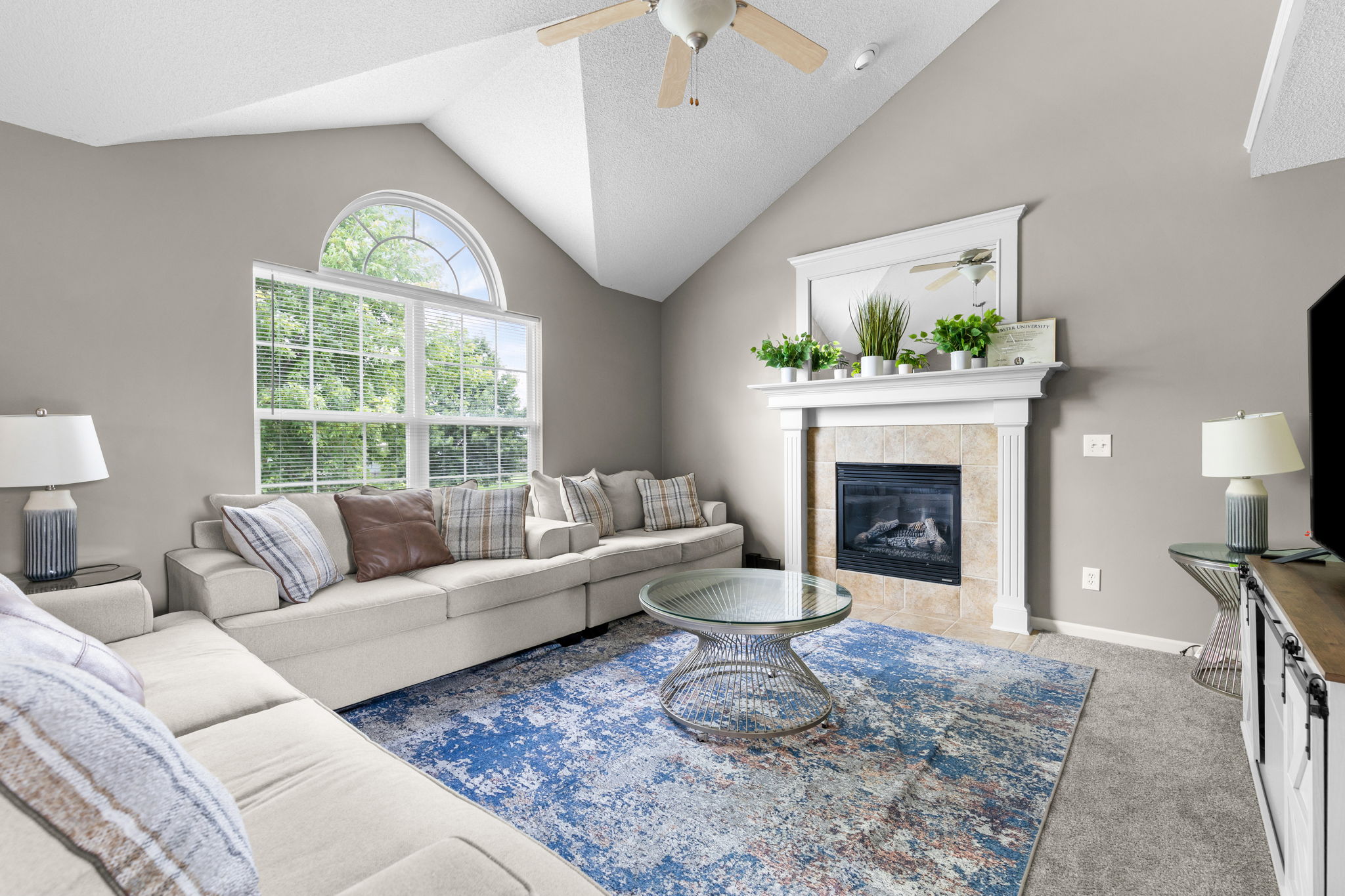 Vaulted living room with gas fireplace at 6819 NE 113th Terrace, Kansas City, MO