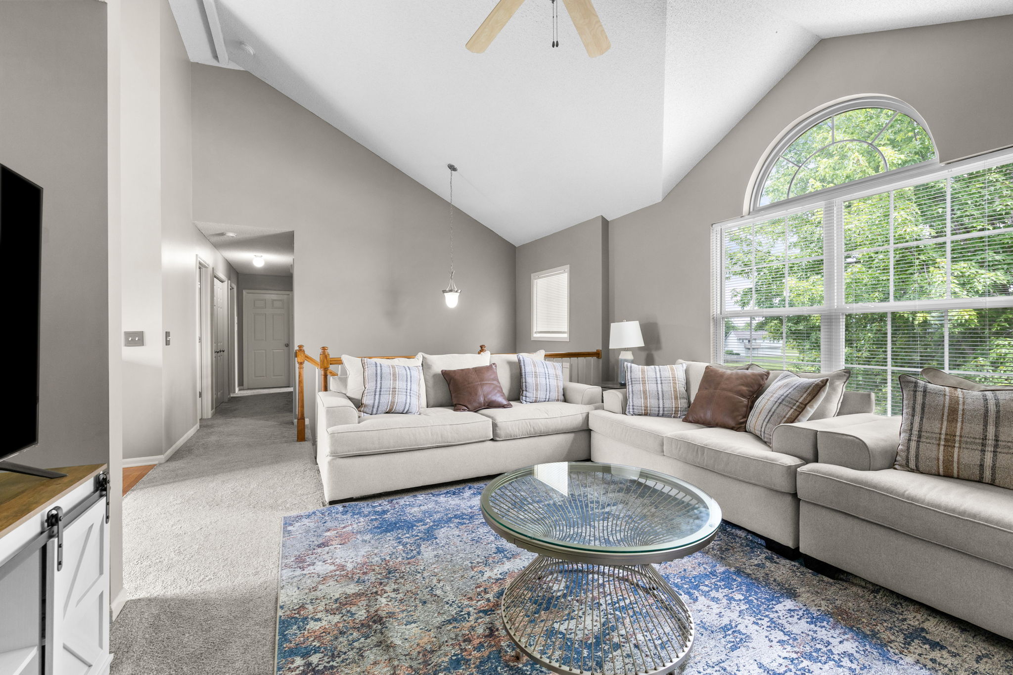 Living room with expansive windows in the Meadows of Auburndale, Kansas City