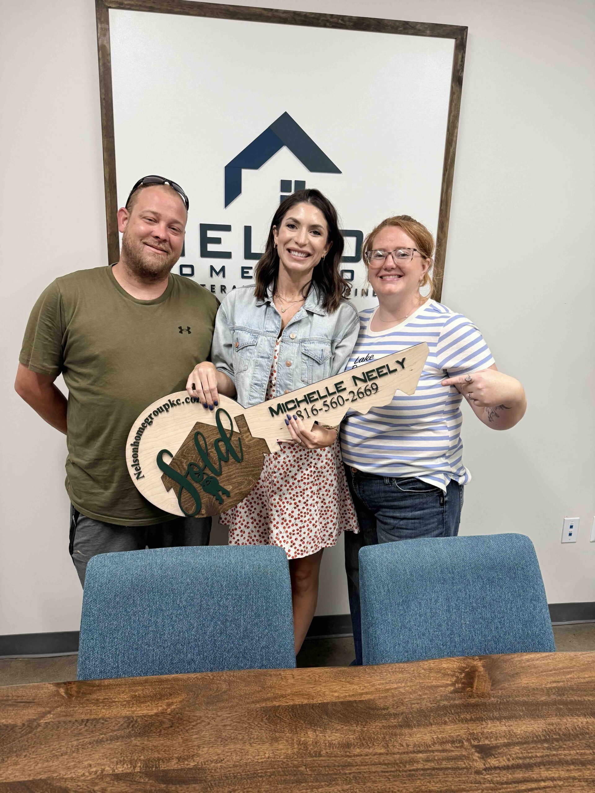 Michael and Amanda at closing with Nelson Home Group agent Michelle Neely