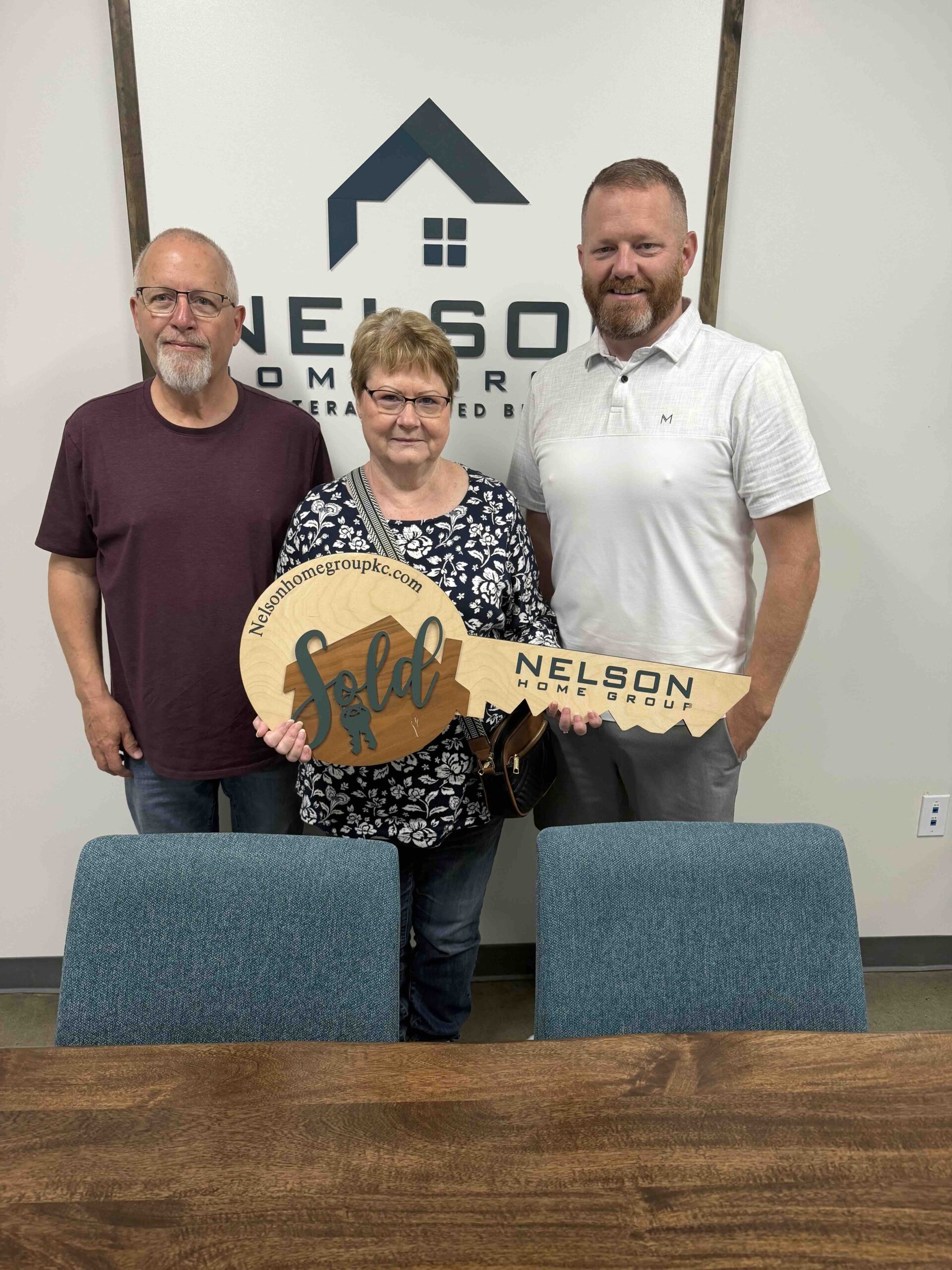 Dean & Janet at closing with Joe Nelson — 803 Cindy Lane SOLD, Raymore MO