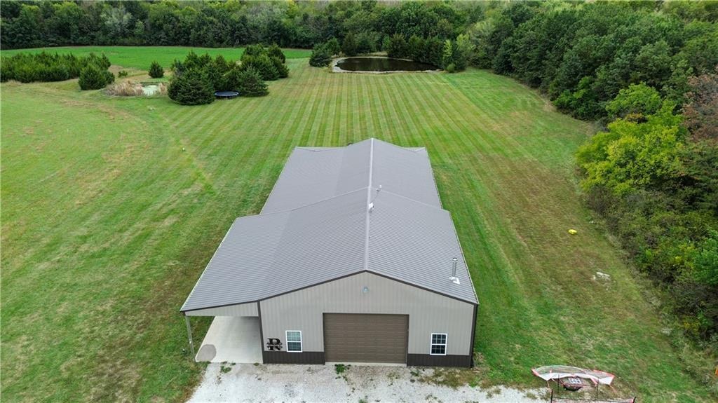 Aerial view of the barndominium at 114 SW 1451 Road, Holden, MO 64040
