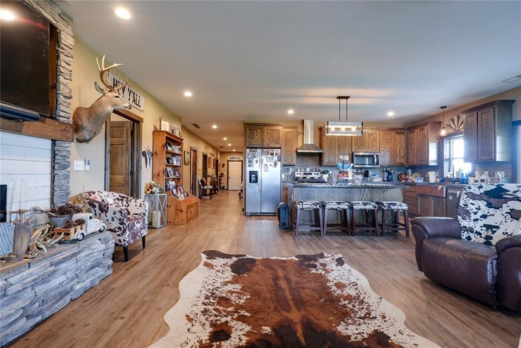 Open-concept great room and kitchen at 114 SW 1451 Road, Holden, MO