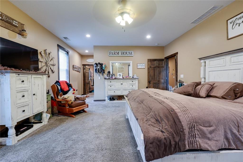 Primary bedroom suite at 114 SW 1451 Road, Holden, MO