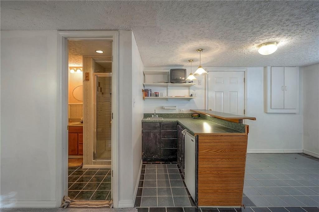 Finished walkout basement wet bar at 6509 NW Twin Oaks Drive