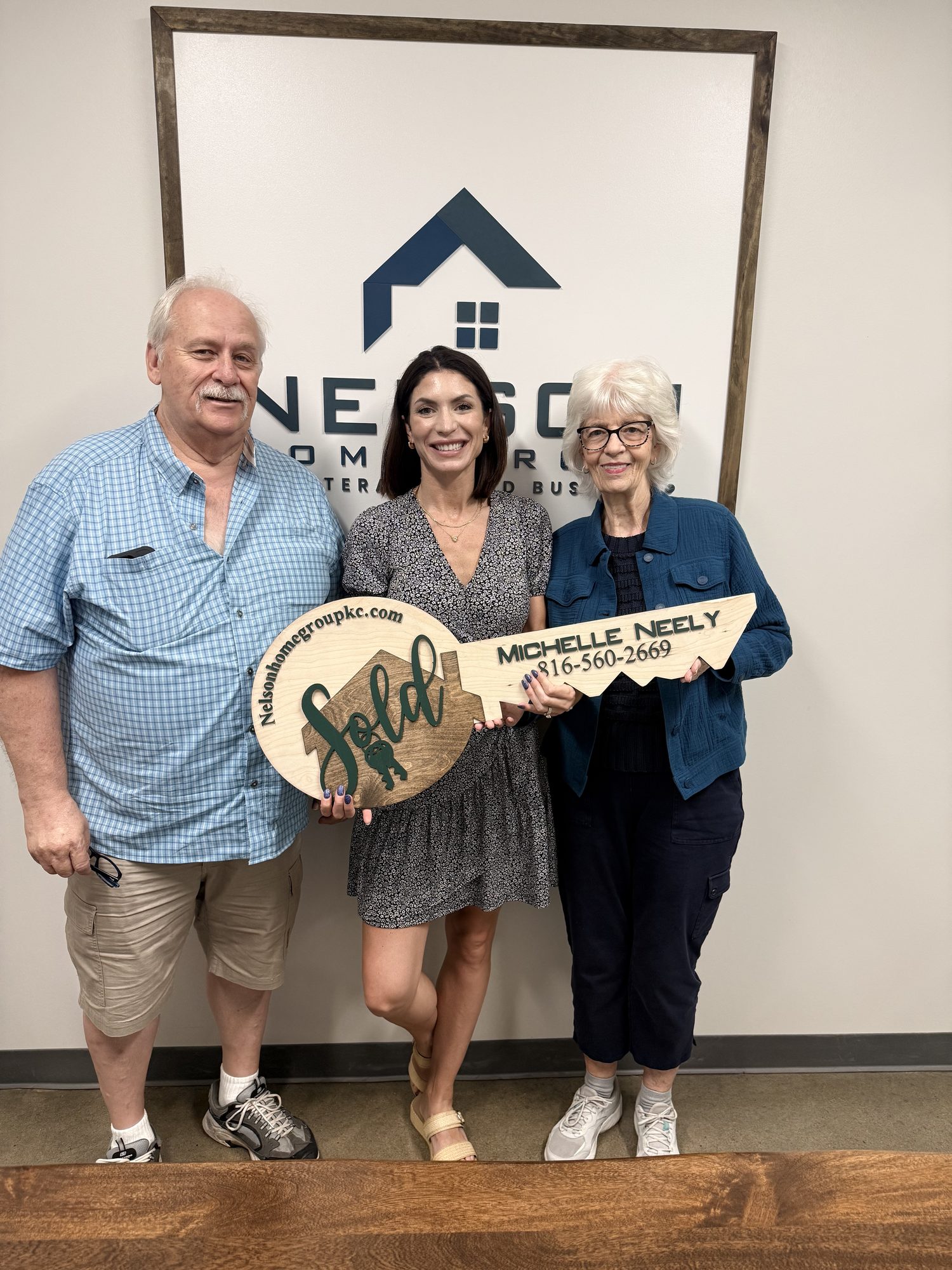 Mike and Leslie with Nelson Home Group agent Michelle Neely on closing day