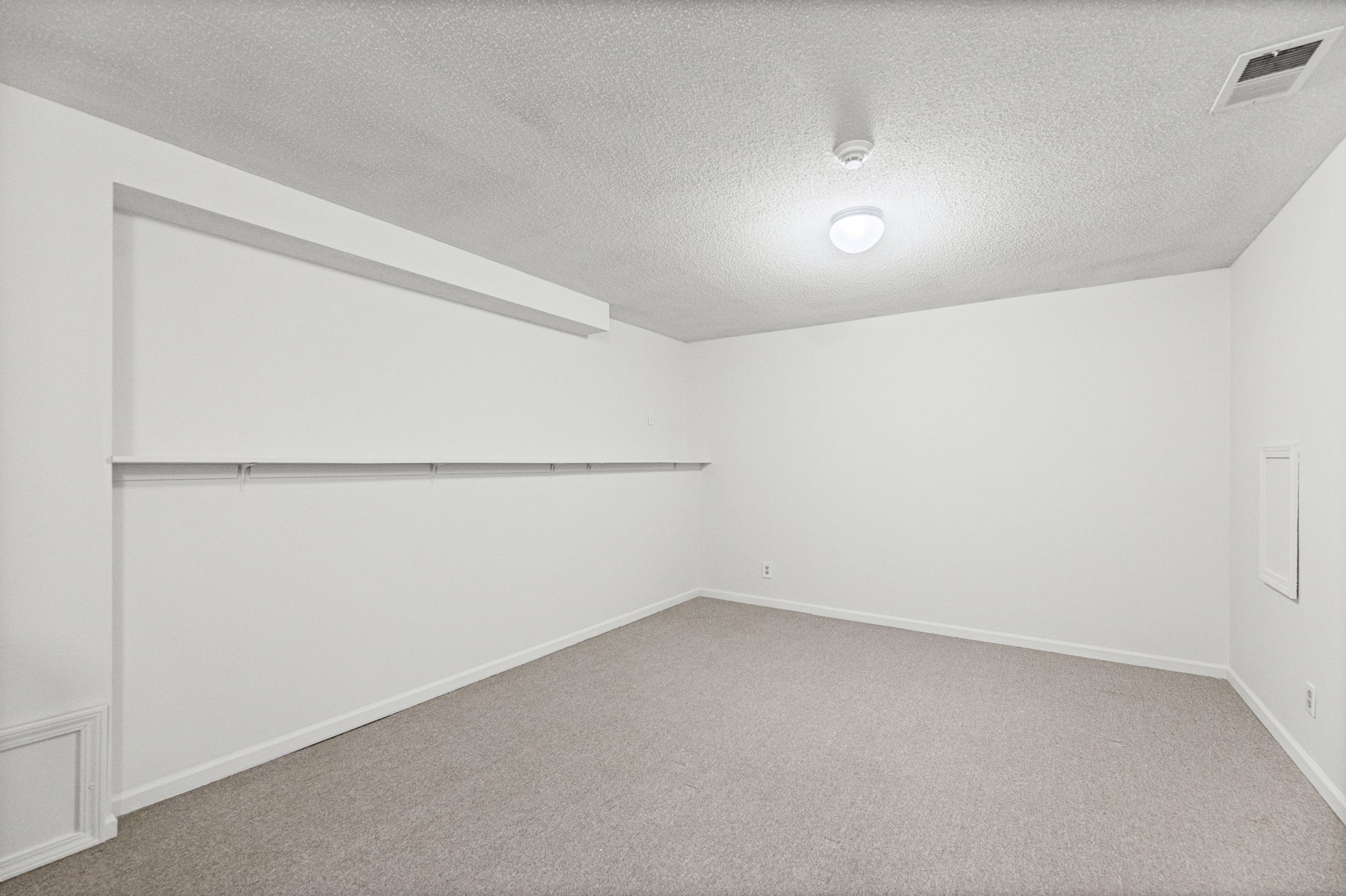 Finished sub-basement bonus room for a gym, office, or workshop at 6409 Chouteau Street, Shawnee KS