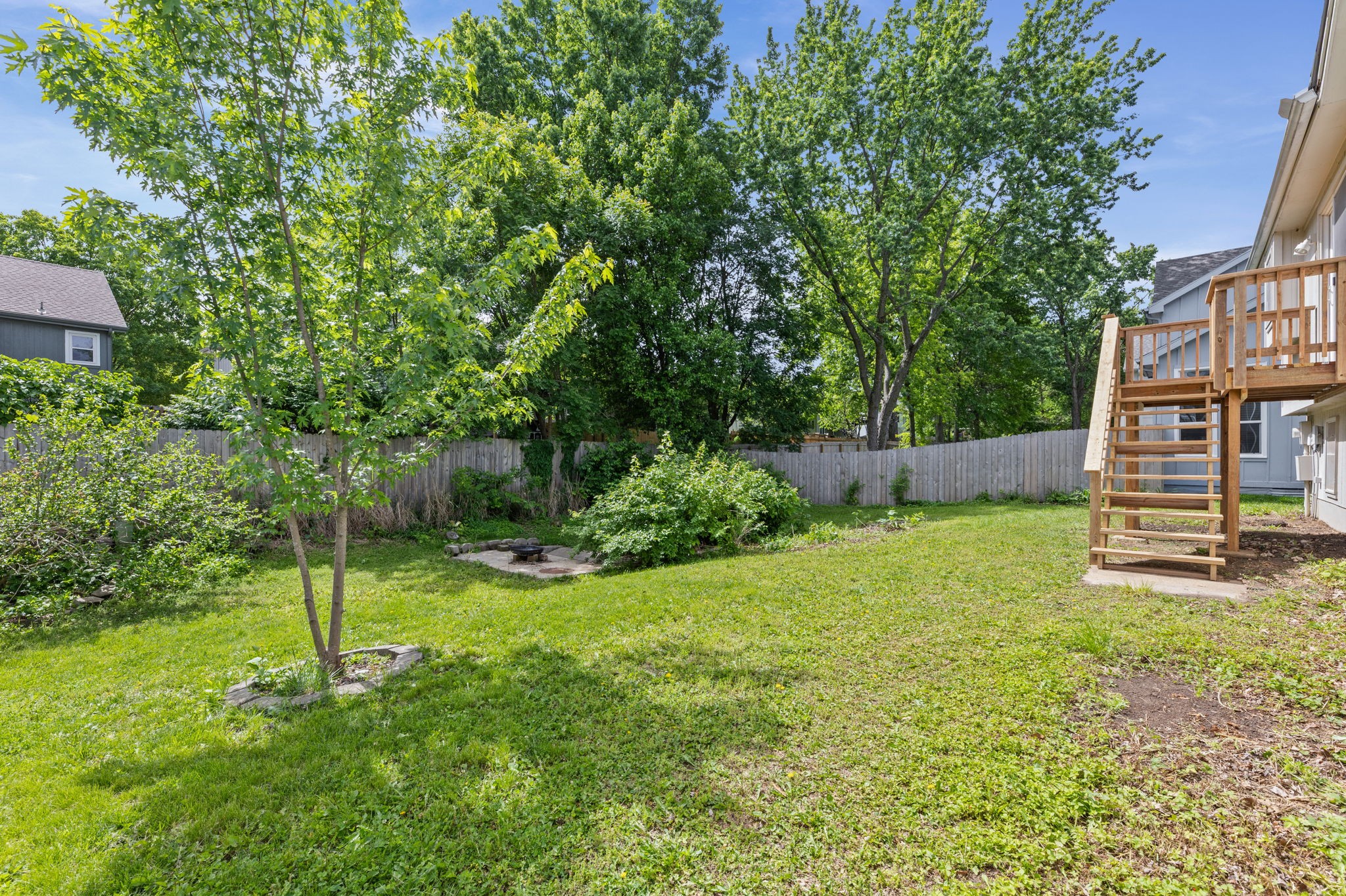 Treed, privacy-fenced backyard at 6409 Chouteau Street, Shawnee KS
