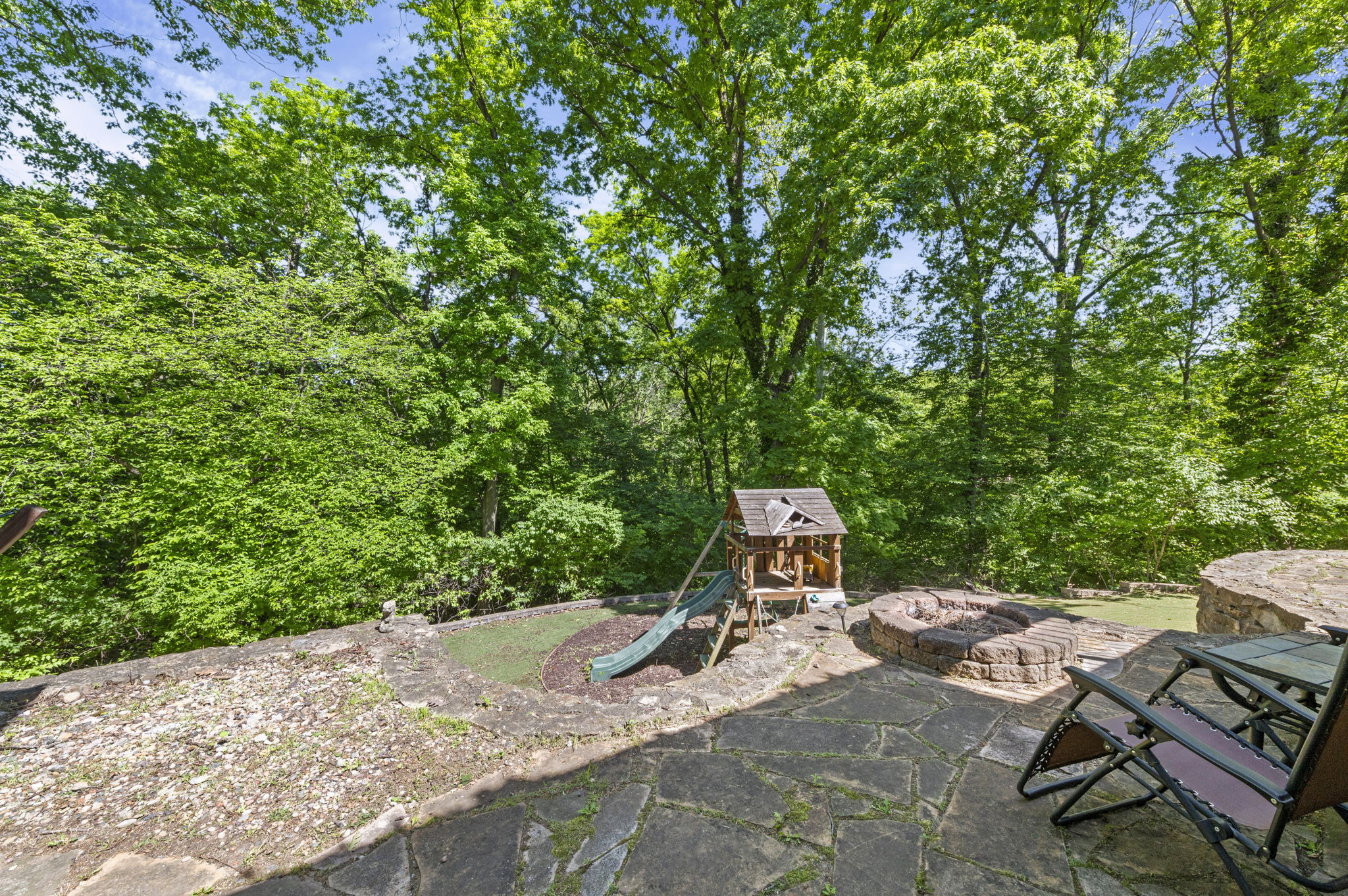 Wooded backyard backing to protected greenspace