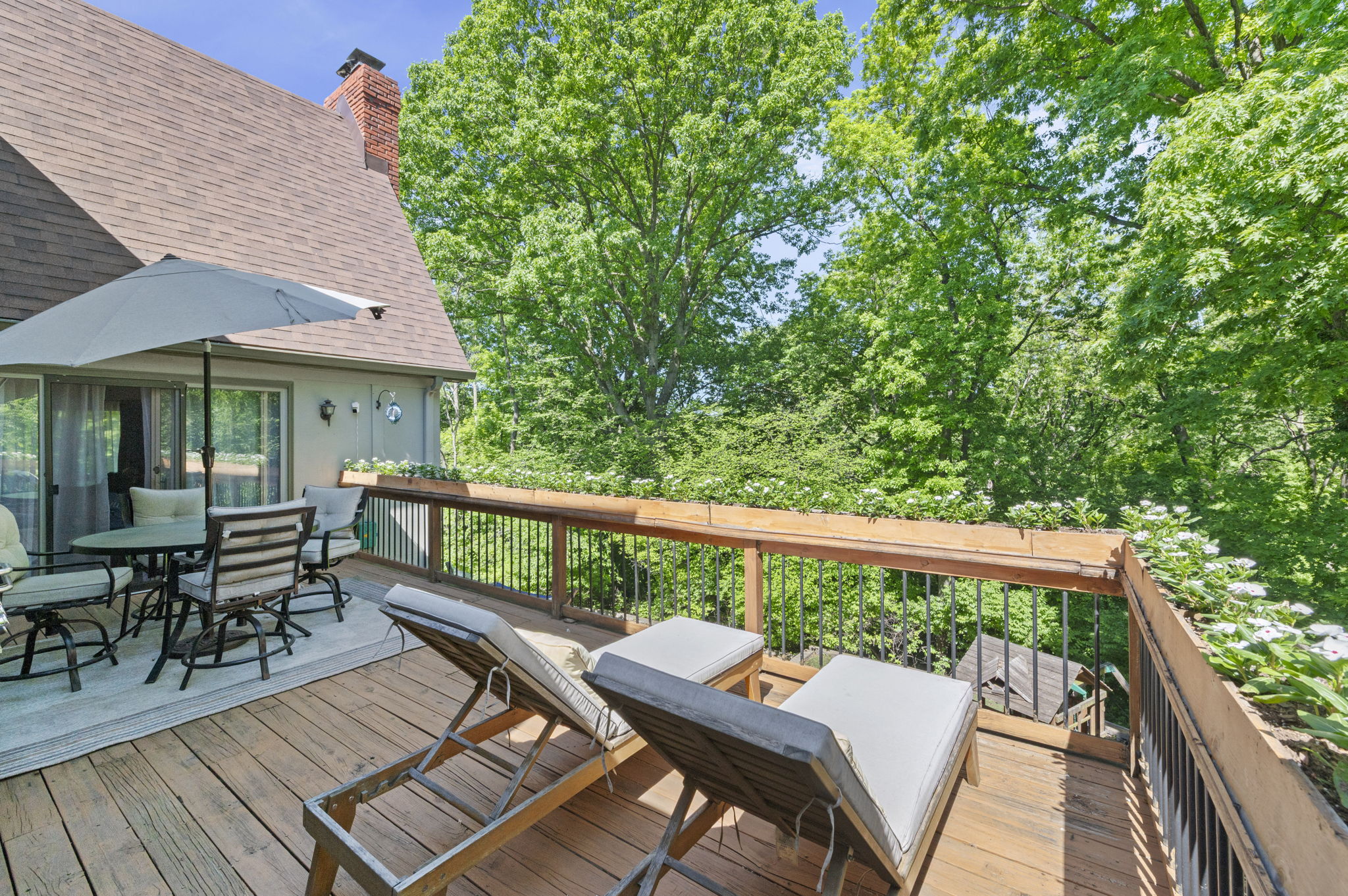 Wood deck with lounge seating and wooded views