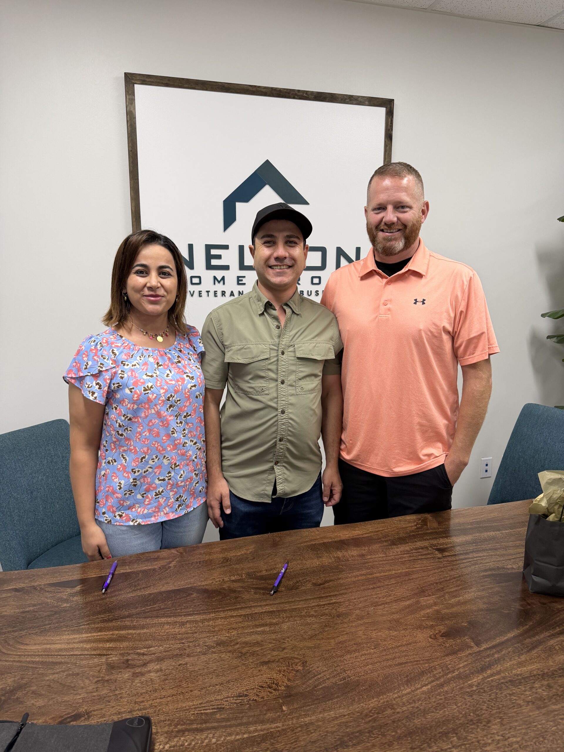 Hardy and Nasren with Joe Nelson at the closing table after selling 6819 NE 113th Terrace, Kansas City, MO