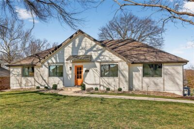 Front exterior of 8206 NW Miami Street, a remodeled raised ranch in Weatherby Lake, Missouri