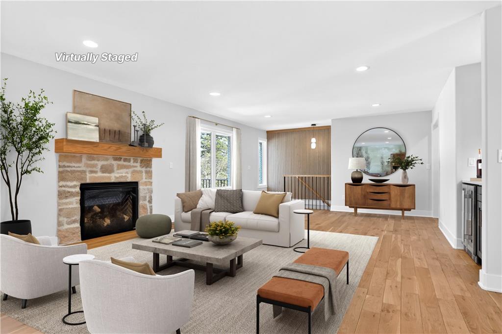 Living room with fireplace at 8206 NW Miami Street