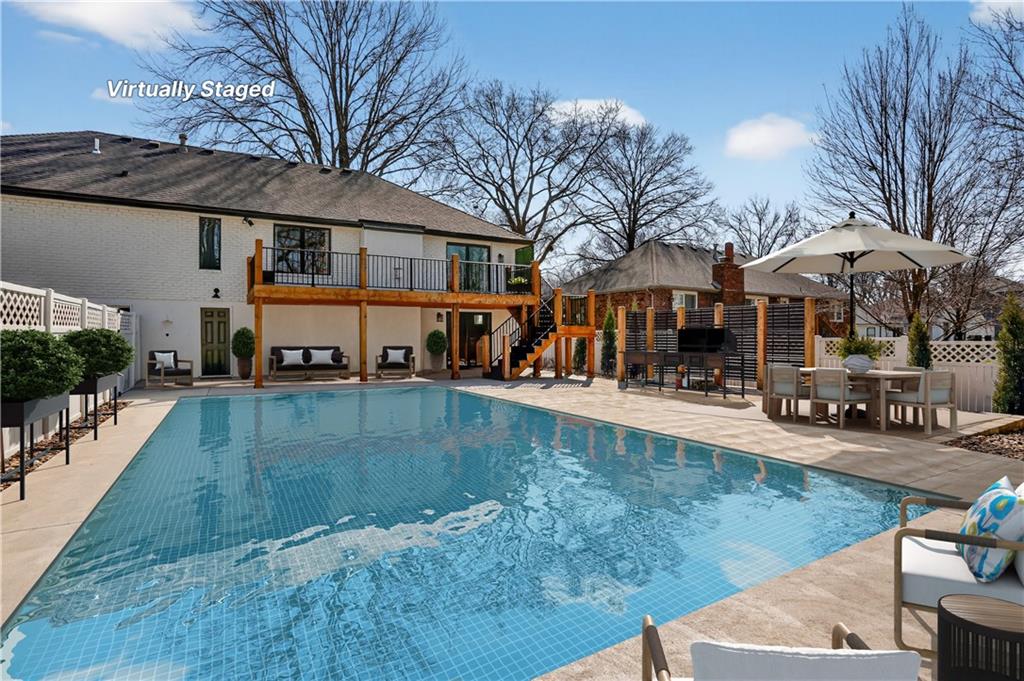 Fully fenced inground pool and new pool deck at 8206 NW Miami Street