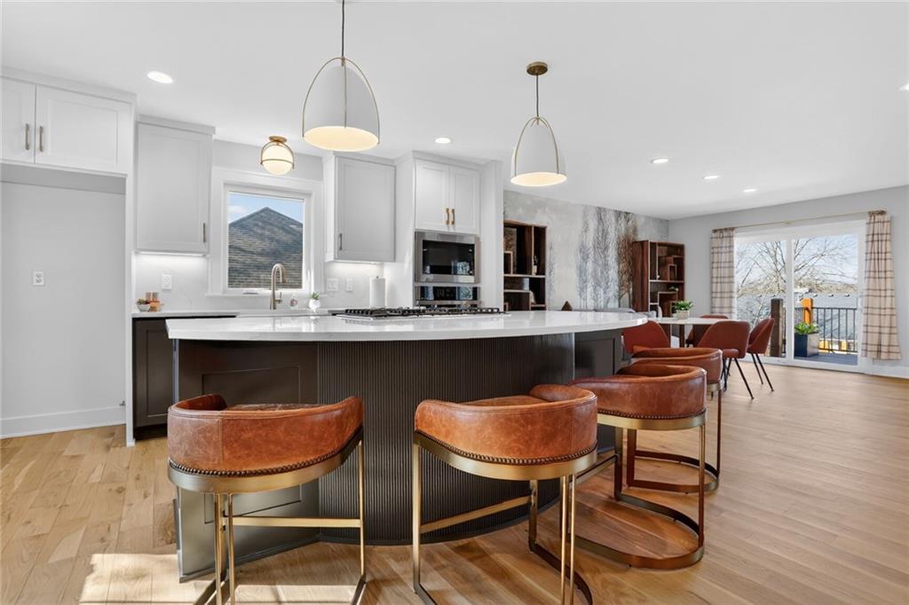 Remodeled kitchen with island and custom cabinets at 8206 NW Miami Street