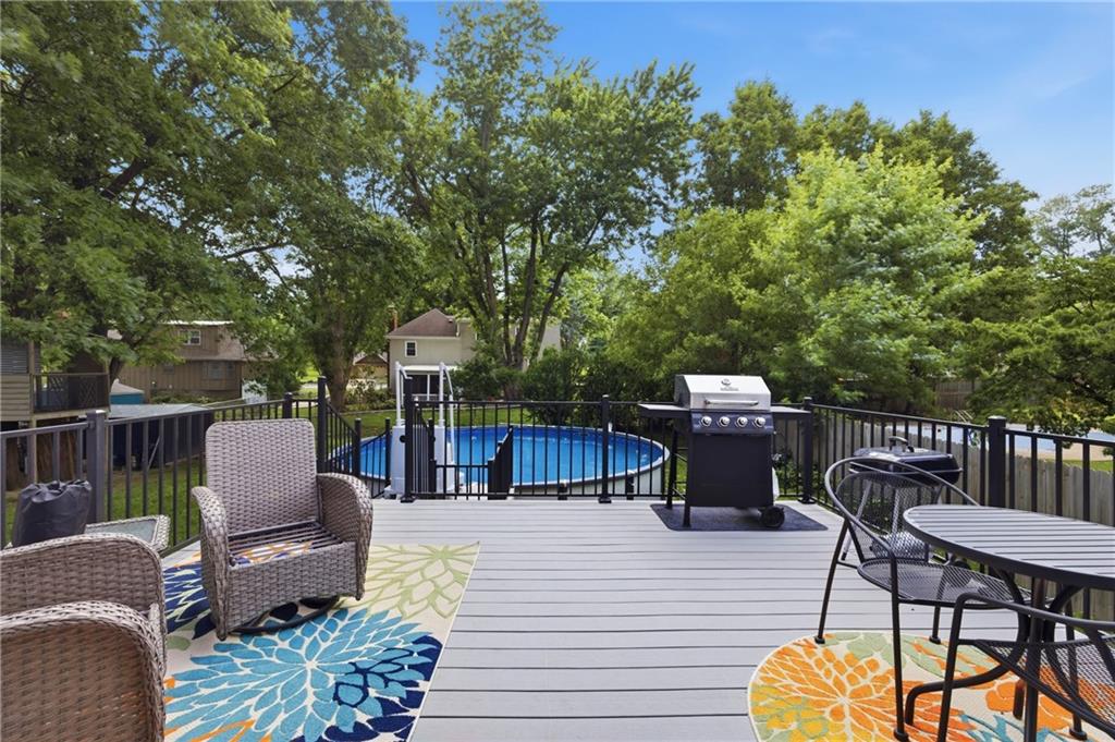 Above ground pool and fenced backyard at 408 N Jefferson Street Raymore MO