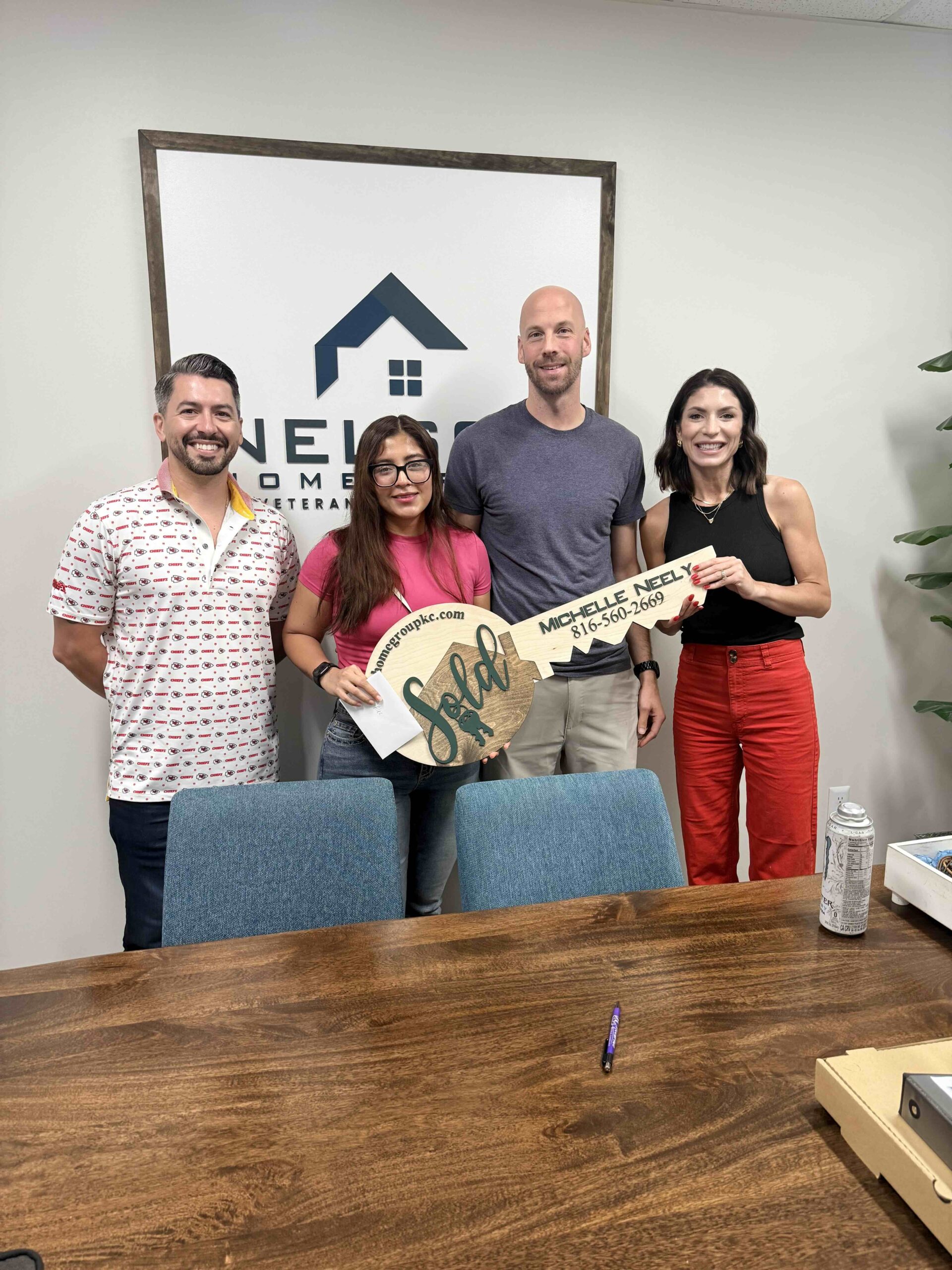 Buyers celebrating closing day with the Nelson Home Group team