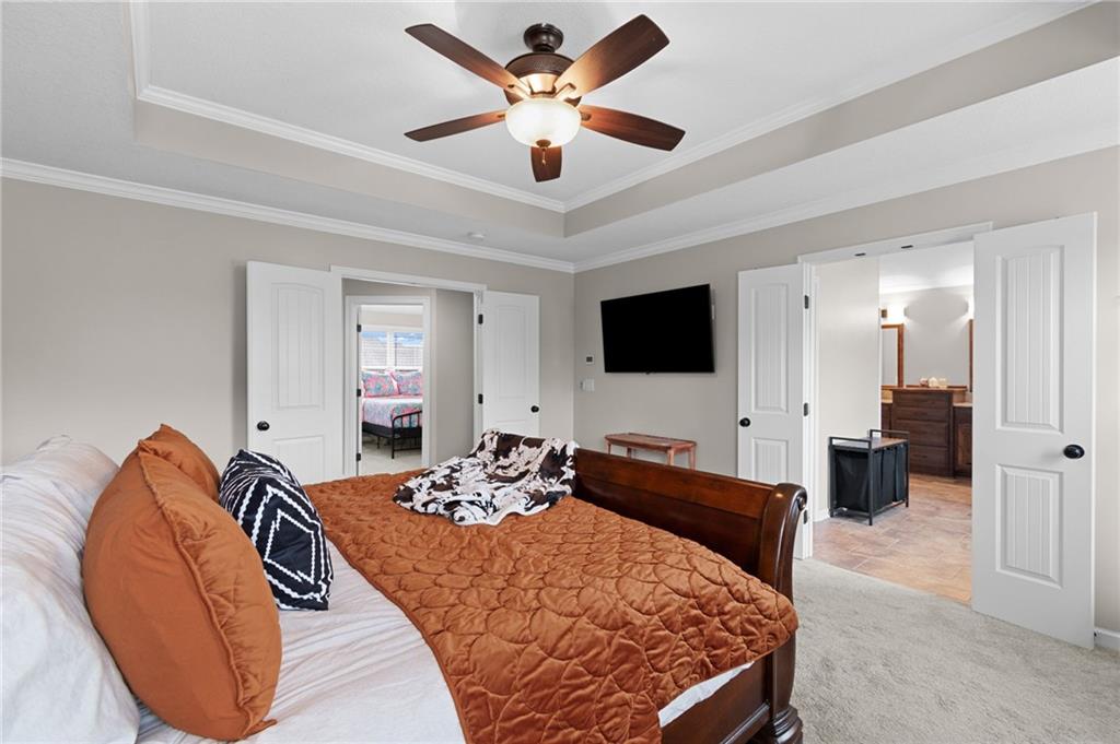 Primary bedroom with tray ceiling