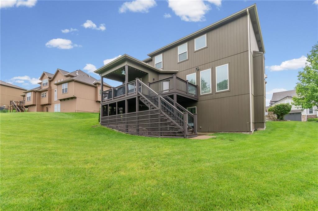 Backyard with deck and walkout basement backing to greenspace