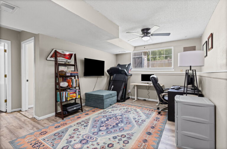 Finished lower-level rec room at 1126 E Charlotte Town Road, Olathe, KS