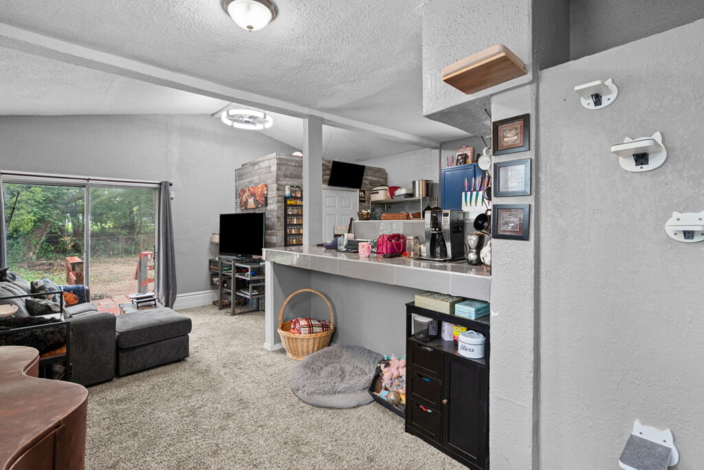 Family room with a sliding door to the rear deck in a Kansas City, Missouri home
