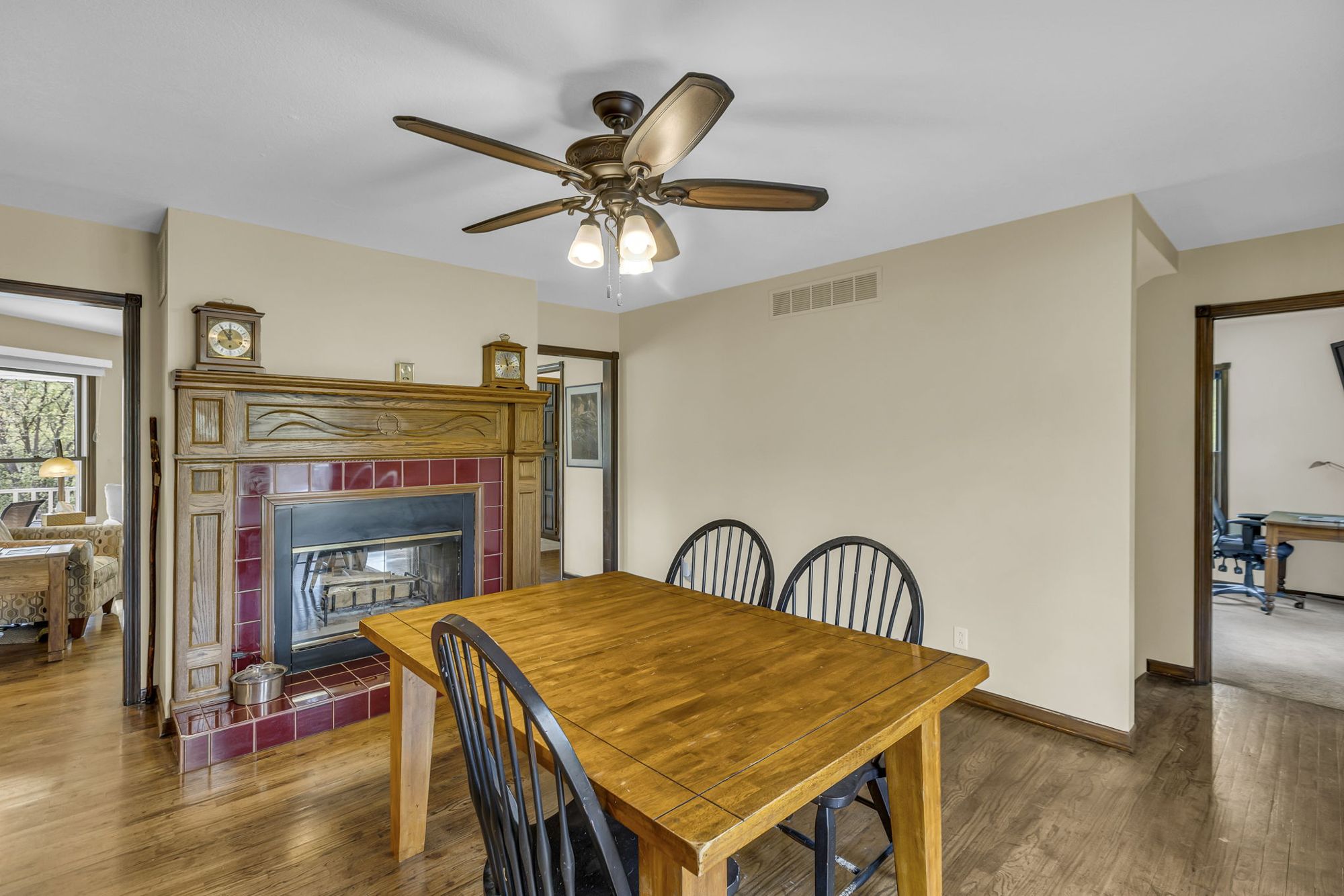 Dining room with pass-through fireplace at 615 Cherry Street, Weston, MO