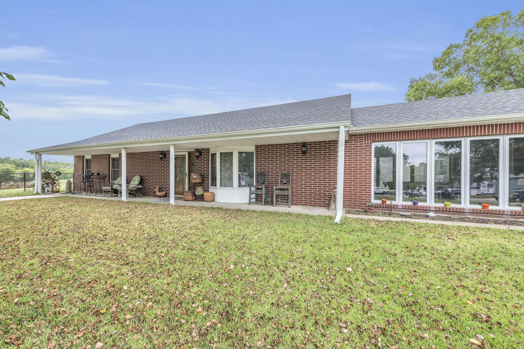 Covered porch and sunroom at 111 Cora Drive, Weston, MO
