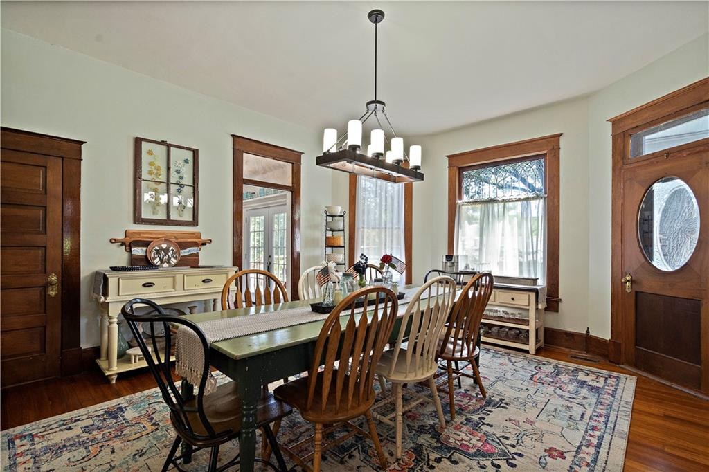 Formal dining room with leaded glass windows at 908 Washington Street, Weston, MO