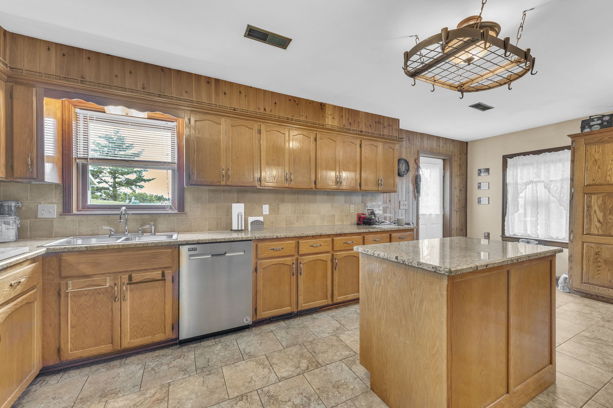 Kitchen with granite countertops at 111 Cora Drive, Weston, MO