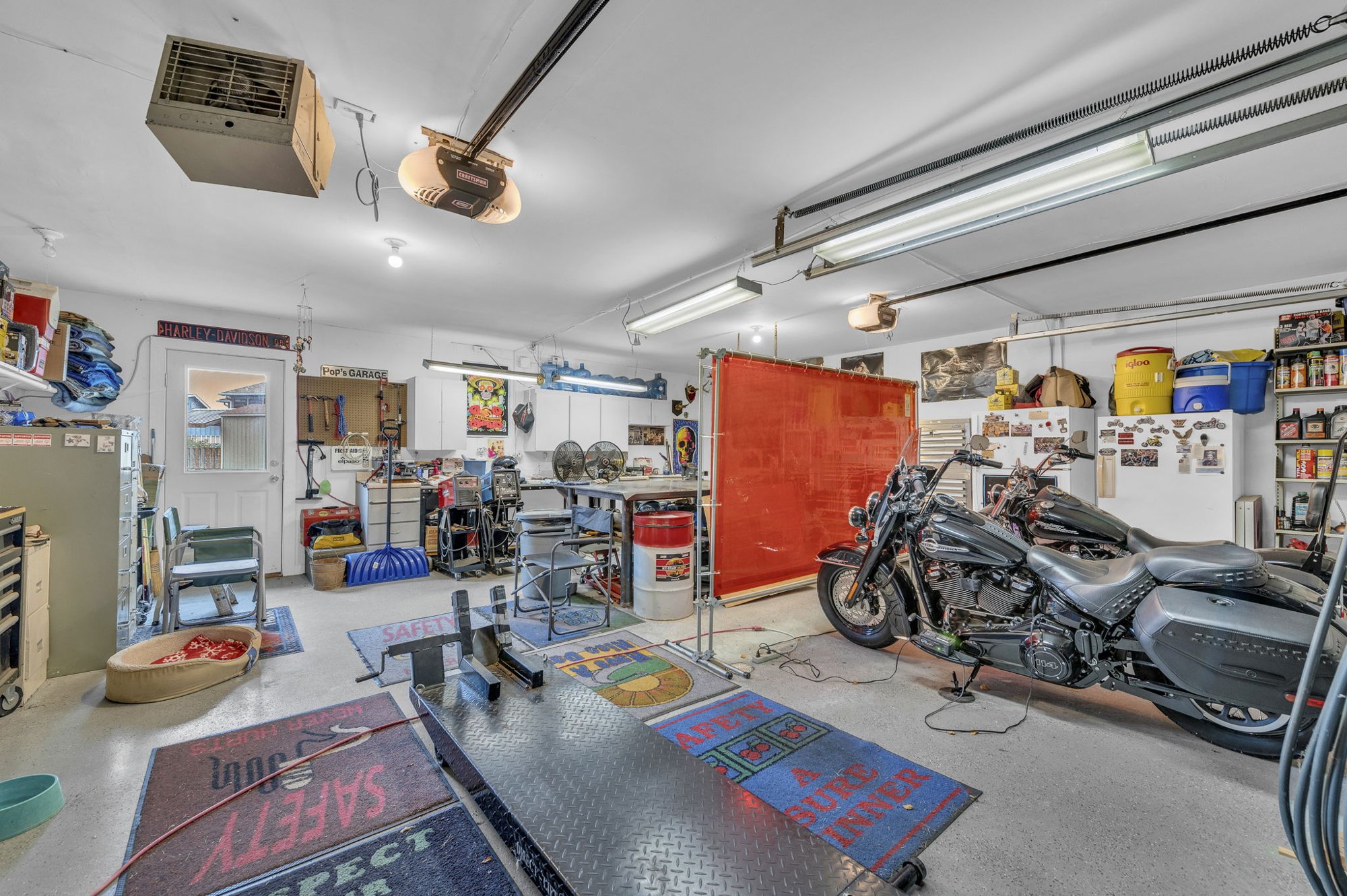 Epoxy-floored two-car garage at 111 Cora Drive, Weston, MO