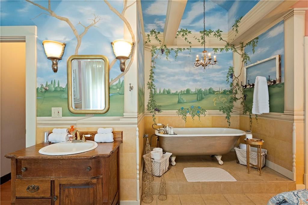 Mural bath with clawfoot tub at 908 Washington Street, Weston, MO