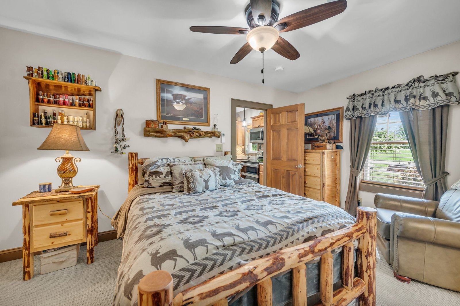 Primary bedroom on one end of the single-level barndominium floor plan