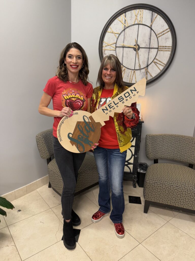 Michelle Neely of Nelson Home Group, Keller Williams KC North with her client Larissa at closing on 7020 N Garfield Avenue in Gladstone, Missouri