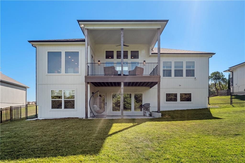 Rear exterior and covered deck backing to greenspace in Summit View Farms, Lee's Summit, Missouri
