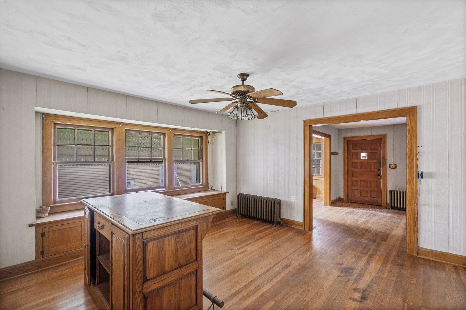 Formal dining room in this Epperson Place bungalow with a built-in bench beneath the windows