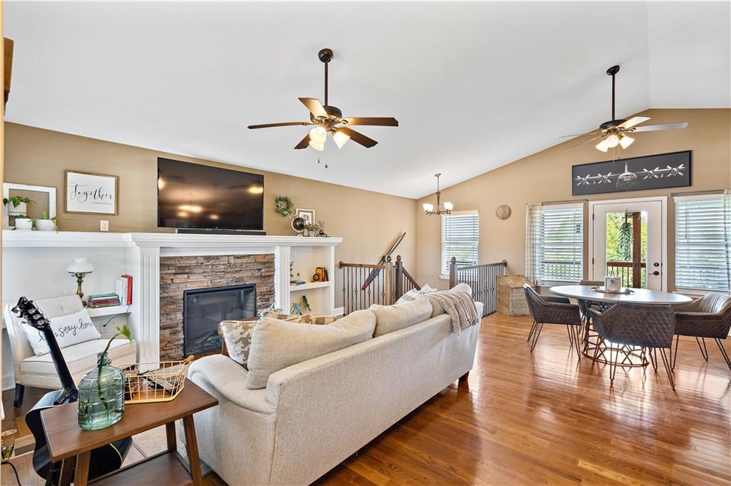 Open living room with a fireplace and built-ins in a Weston, MO ranch home