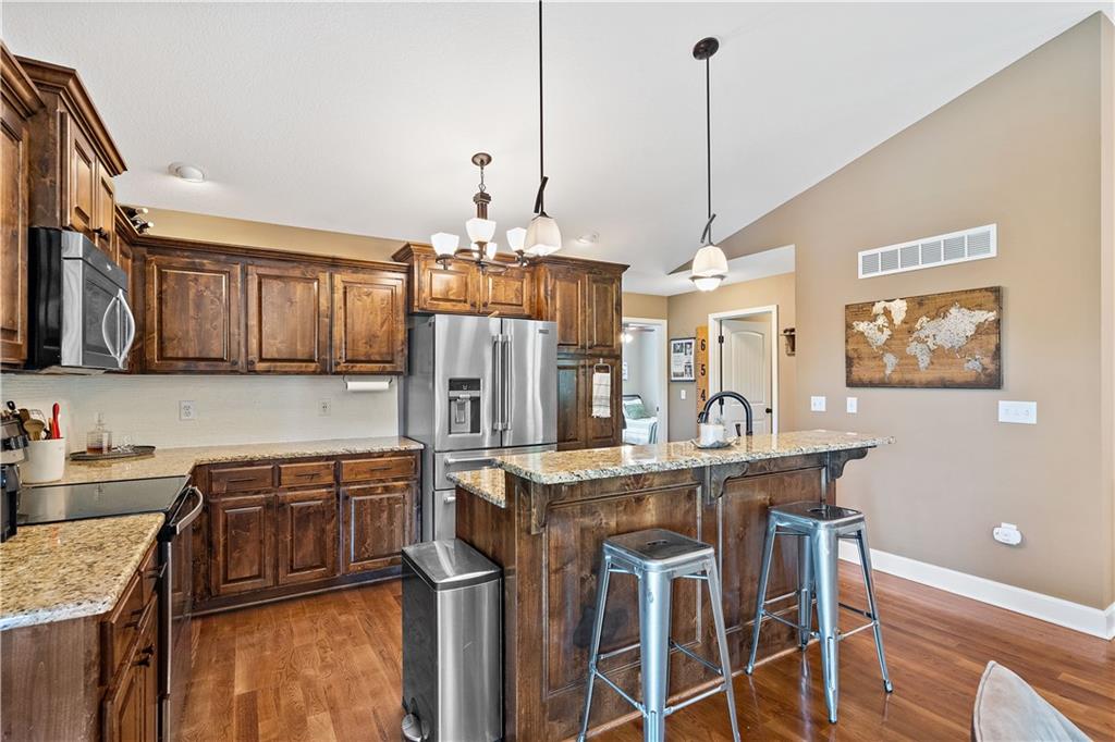 Kitchen with granite counters and a large island in a Weston, MO ranch home